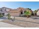 Single-Gathering home featuring neutral stucco, a two-car garage, and desert landscaping with a small palm tree at 3898 E San Remo Ave, Gilbert, AZ 85234