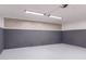 Clean, open garage space with tiled wall at 3898 E San Remo Ave, Gilbert, AZ 85234