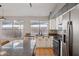 Lovely kitchen featuring granite countertops, a double sink, and modern appliances at 3898 E San Remo Ave, Gilbert, AZ 85234