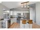 Eat-in kitchen with granite countertops, stainless steel appliances, and generous storage at 3898 E San Remo Ave, Gilbert, AZ 85234
