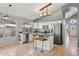 Bright kitchen with white cabinets, granite countertops, and stainless steel appliances at 3898 E San Remo Ave, Gilbert, AZ 85234