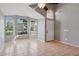 Living room with tile floors, gray walls, a ceiling fan, many windows, and front door at 3898 E San Remo Ave, Gilbert, AZ 85234