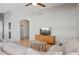 Cozy living room featuring neutral tones, tile flooring, and a ceiling fan at 3898 E San Remo Ave, Gilbert, AZ 85234