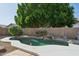Enjoy a refreshing pool with a rock waterfall feature set within a private backyard oasis at 3898 E San Remo Ave, Gilbert, AZ 85234
