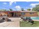Inviting backyard featuring a sparkling pool, patio seating, and well-maintained landscaping, perfect for outdoor entertaining at 3919 S Siesta Ln, Tempe, AZ 85282