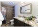 Renovated bathroom with granite vanity, modern fixtures, and a stylishly tiled shower area at 3919 S Siesta Ln, Tempe, AZ 85282
