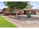 Charming home with brick accents and a well-maintained yard featuring desert landscaping for curb appeal at 3919 S Siesta Ln, Tempe, AZ 85282