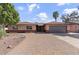 Attractive brick home with a wide driveway, a two-car garage and beautiful landscaping, providing a welcoming entrance at 3919 S Siesta Ln, Tempe, AZ 85282