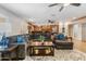 Spacious living room includes a large sectional sofa and an open view to the kitchen for seamless living at 3919 S Siesta Ln, Tempe, AZ 85282