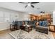 Comfortable living room boasts a sectional sofa, plantation shutters, and easy access to the kitchen at 3919 S Siesta Ln, Tempe, AZ 85282