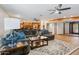 Spacious living room features a large sectional sofa, stylish rug, and open floor plan to the kitchen at 3919 S Siesta Ln, Tempe, AZ 85282