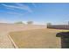 Spacious backyard featuring low maintenance landscaping and a block wall, ideal for outdoor activities at 4084 E Caitlin Dr, San Tan Valley, AZ 85140