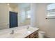 Bathroom features a double sink vanity, a toilet, and a shower with a curtain at 4084 E Caitlin Dr, San Tan Valley, AZ 85140