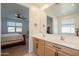 Elegant bathroom featuring a double vanity with sleek hardware and a large mirror reflecting the Primary bedroom at 4084 E Caitlin Dr, San Tan Valley, AZ 85140