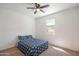 This bedroom features carpet, a ceiling fan, and a window providing natural light at 4084 E Caitlin Dr, San Tan Valley, AZ 85140