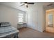 Bedroom featuring carpet, ceiling fan, a desk, closet, and a window providing natural light at 4084 E Caitlin Dr, San Tan Valley, AZ 85140