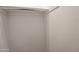 Walk-in closet showing the white walls and chrome hanging bar at 4084 E Caitlin Dr, San Tan Valley, AZ 85140