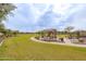 Scenic community park featuring playground equipment, picnic tables, and open green spaces at 4084 E Caitlin Dr, San Tan Valley, AZ 85140