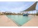 Community pool area with lounge chairs and splash features, perfect for relaxation and Gathering fun at 4084 E Caitlin Dr, San Tan Valley, AZ 85140