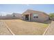 Exterior view of home with a low maintenance backyard and covered patio at 4084 E Caitlin Dr, San Tan Valley, AZ 85140