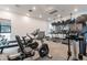 Bright community gym featuring cardio machines, a weight rack, and large screen televisions for residents enjoyment at 4084 E Caitlin Dr, San Tan Valley, AZ 85140