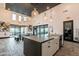 Common area kitchen with counter seating, modern fixtures, and a view of the outdoor patio and seating area at 4084 E Caitlin Dr, San Tan Valley, AZ 85140