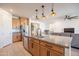 Kitchen showcasing an island, stainless steel appliances, granite countertops, and seamless layout to living area at 4084 E Caitlin Dr, San Tan Valley, AZ 85140