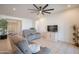 Comfortable living area with tile floors, recessed lighting, and neutral-colored reclining couches at 4084 E Caitlin Dr, San Tan Valley, AZ 85140