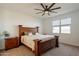 Main bedroom features carpet, a ceiling fan, and a window providing natural light at 4084 E Caitlin Dr, San Tan Valley, AZ 85140