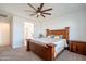 Main bedroom features carpet, ceiling fan, and a connecting bathroom for convenience at 4084 E Caitlin Dr, San Tan Valley, AZ 85140
