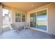 Covered patio area with comfortable seating, sliding glass doors to indoor living area and desert views at 4084 E Caitlin Dr, San Tan Valley, AZ 85140