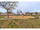 Community playground featuring modern play structure, slide, and picnic area, perfect for outdoor fun at 4084 E Caitlin Dr, San Tan Valley, AZ 85140
