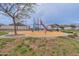 Community playground with slide, climbing structure, swing, and picnic area with green common areas at 4084 E Caitlin Dr, San Tan Valley, AZ 85140