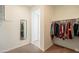 Well-organized walk-in closet with ample hanging space and a full length mirror at 4084 E Caitlin Dr, San Tan Valley, AZ 85140