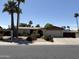 Charming single-Gathering home with lush landscaping and a welcoming front yard at 4841 W Mercer Ln, Glendale, AZ 85304