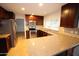 Modern kitchen with dark cabinets, stainless steel appliances, and granite countertops at 4841 W Mercer Ln, Glendale, AZ 85304