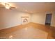 Bright living space with tiled floors, an arched fireplace, and recessed lighting at 4841 W Mercer Ln, Glendale, AZ 85304