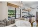 Charming breakfast nook with a marble table, cushioned bench, and view to the outdoor living space at 4916 E Flower St, Phoenix, AZ 85018
