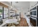 Bright kitchen with a breakfast nook, stainless steel appliances, and black countertops at 4916 E Flower St, Phoenix, AZ 85018