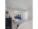 Spacious main bedroom with attached office/gym area, featuring neutral colors and soft carpet at 4916 E Flower St, Phoenix, AZ 85018