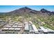 Aerial view of modern homes nestled next to a golf course, with mountain views and ample parking at 5533 E Stella Ln, Paradise Valley, AZ 85253