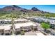 Stunning aerial view features modern homes nestled within a desert landscape and mountain views at 5533 E Stella Ln, Paradise Valley, AZ 85253