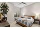 A light-filled bedroom offers a bench under the window and a decorative lamp on the nightstand at 5533 E Stella Ln, Paradise Valley, AZ 85253