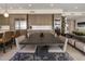 Dining area with modern dark wood table, light wood cabinetry, and stainless steel refrigerator at 5533 E Stella Ln, Paradise Valley, AZ 85253
