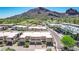 A lovely exterior elevation showcases modern architecture and desert landscaping against a mountain backdrop at 5533 E Stella Ln, Paradise Valley, AZ 85253