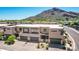 Clean modern home elevation highlighting garages, desert landscaping, and a welcoming entryway at 5533 E Stella Ln, Paradise Valley, AZ 85253