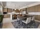 Kitchen and dining area with stainless steel appliances, spacious island, and seating for four at 5533 E Stella Ln, Paradise Valley, AZ 85253