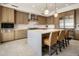 Bright kitchen featuring a center island, stainless steel appliances, and light wood cabinets at 5533 E Stella Ln, Paradise Valley, AZ 85253