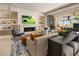 This open-concept living space offers a seamless blend of a cozy living room with fireplace and an outdoor patio at 5533 E Stella Ln, Paradise Valley, AZ 85253