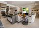 This open-concept living space offers a seamless blend of a dining area and a cozy living room with a fireplace at 5533 E Stella Ln, Paradise Valley, AZ 85253